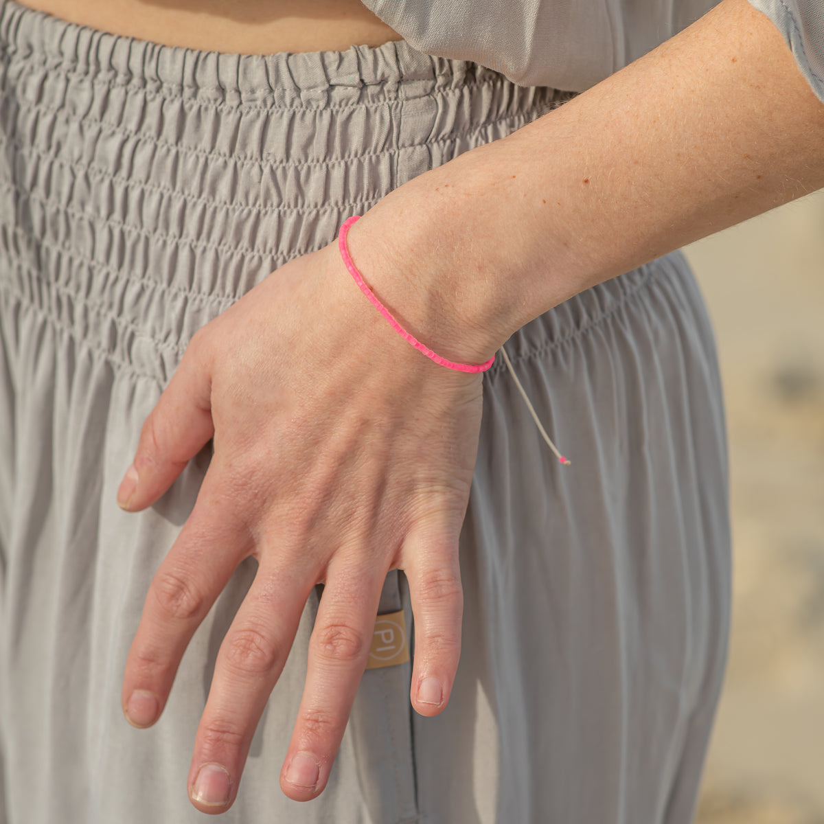 Neon Pink Beaded String Bracelet